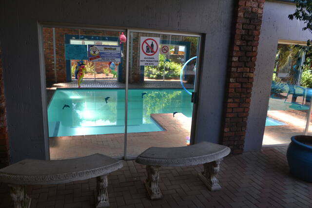 View of the pool through the glass doors