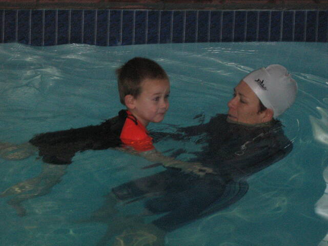 Instructor teaching a young boy