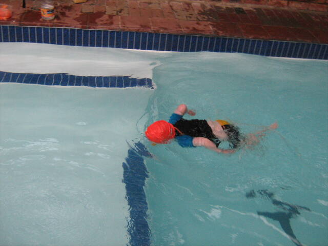 Child swimming in the pool