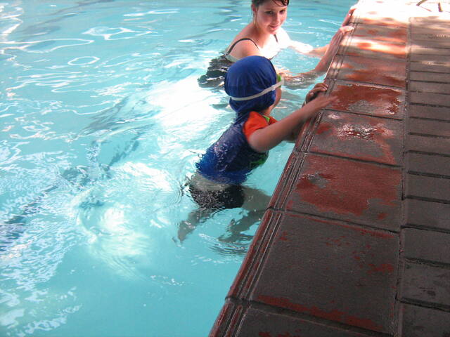 Learner practising at the pool edge