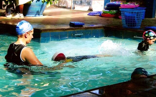 Instructor with learners in the pool